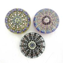 Perthshire, three millefiori glass paperweights, pre 1978, opaque yellow, black and pink grounds,