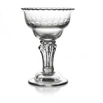 A composite stem pedestal sweetmeat glass, circa 1760, the double ogee bowl engraved with OXO band