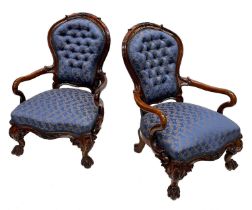 A pair of mid-Victorian rosewood balloon back parlour armchairs, circa 1860, foliate and scroll