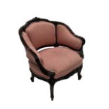 A rosewood boudoir fauteuil, of Louis XV design, serpentine top rail with foliate carving,
