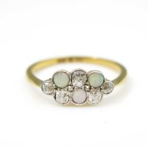 An Edwardian diamond and opal ring, on 18ct gold, pave set with old cut and cabochon stones, size Q,