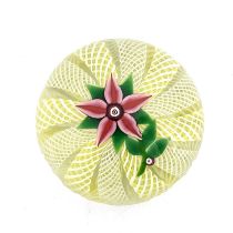 Paul Ysart for Harland, a floral glass paperweight, the five petal pin flower on a cushioned