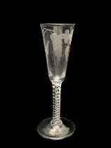 A double series opaque twist ale flute, circa 1760, the round funnel bowl etched and engraved with