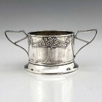 Kate Harris for Goldsmiths and Silversmiths Company, an Arts and Crafts silver twin handled dish,