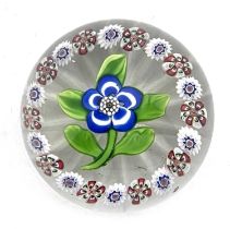 Baccarat, a small floral and millefiori glass paperweight, 19th century, the central blue and