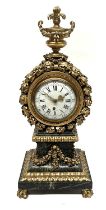 A large European bracket clock, 19th Century, of Baroque design, gilt wood and metal, 19cm enamel