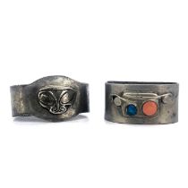 Archibald Knox for Liberty and Co., two Tudric Arts and Crafts pewter napkin rings, one with
