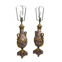 A pair of pink veined marble table lamp bases, of Neo-classical design, ormolu mounts comprising