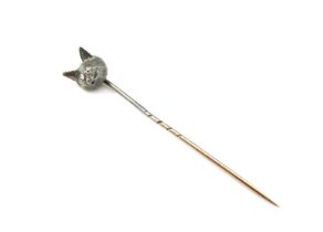 A 15ct gold and diamond set stick pin, modelled as a foxes head set with diamond chip eyes, 5.5cm