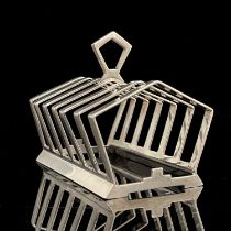 Keith Murray for Mappin and Webb, an Art Deco silver plated six division toast rack, circa 1934, the