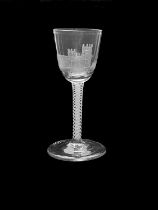 An opaque twist wine glass, circa 1765, the round funnel bowl engraved with a church and disguised