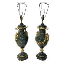 A pair of green-veined marble table lamp bases, of Neo-classical urn design, gilt ormolu mounts