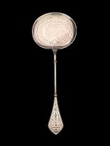 A Norwegian Aesthetic Movement silver serving spoon, Marius Hammer, Bergen 1888, the wide oval