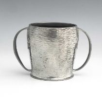 Archibald Knox for Liberty and Co., an Arts and Crafts Tudric pewter twin handled mug, model 0929,