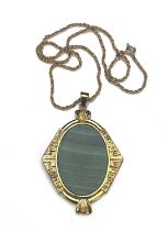 A silver gilt malachite pendant, with gold chain