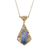 Rhoda Wagner (attributed), an Arts and Crafts 9 carat gold and opal pendant, H P, the oval stone