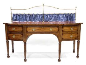 A 19th Century mahogany breakfront sideboard, tubular brass raised back with urn finials, rosewood