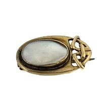 Archibald Knox for Liberty and Co, an Arts and Crafts gold and blister pearl set brooch, model 1288,