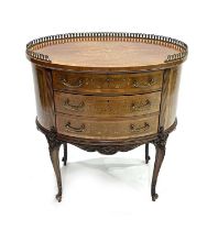 An Edwards & Roberts satinwood oval boudoir table, circa 1900. of Louis XVI design, gilt metal
