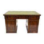 A Victorian mahogany partners' pedestal desk, circa 1870, gilt-tooled green leather inset writing