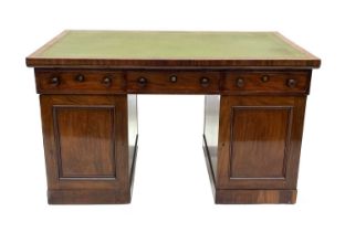 A Victorian mahogany partners' pedestal desk, circa 1870, gilt-tooled green leather inset writing