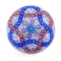 Baccarat, a millefiori garland and latticinio ground glass paperweight, 1971, the central multi