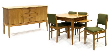 Gordon Russell of Broadway, a 1960s walnut and crossbanded dining suite, comprising a sideboard with