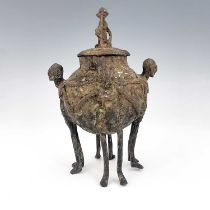 Tribal Interest, Dogon Tribe, a copper tobacco jar, figurative feet, 20cm high