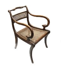 A Regency stained beech bergere armchair, circa 1810, in the manner of Thomas Hope, gadroon carved