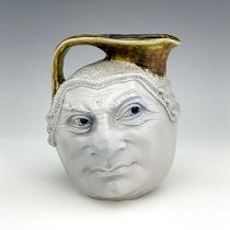 Robert Wallace Martin for Martin Brothers, a stoneware characterful Barrister face jug, circa