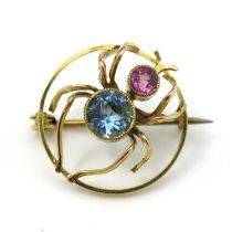 A 9 carat gold aquamarine and pink tourmaline spider brooch, modelled with facet cut gem body and