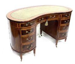 An Edwardian mahogany kidney-shaped pedestal writing desk, circa 1910, of Sheraton revival design,