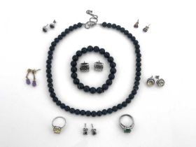 A collection of gem set jewellery, including a citrine ring and earring set, sapphire and ruby