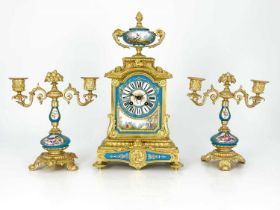 A French porcelain and ormolu mounted clock garniture, circa 1885, the chiming clock movement