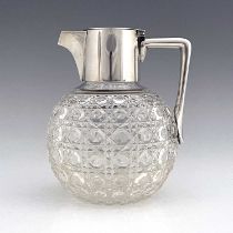 After Christopher Dresser, an Aesthetic Movement silver and cut glass claret jug, Heath and