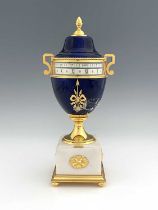 Hour Lavigne, Paris for Garrard, an urn clock of Empire design, lapis lazuli simulated domed lacquer