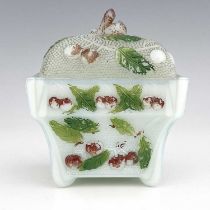 An opaline glass sugar bowl and cover, relief moulded with cherries polychrome enamelld, square