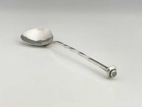 A E Jones, an Arts and Crafts silver spoon, Birmingham 1907, triangular planished bowl on a square