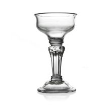 A hollow stemmed pedestal sweetmeat glass, circa 1740, the lipped double ogee bowl on a triple