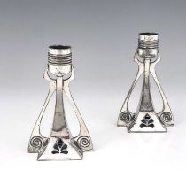 WMF, a pair of Jugendstil silver plated candlesticks, buttressed square section trumpet form,