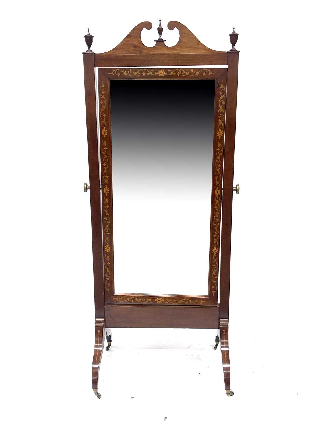 An Edwardian mahogany cheval dressing mirror, circa 1910, swan neck pediment, urn finials, floral