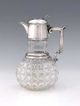A Victorian silver mounted claret jug, the hobnail cut glass body with star cut base, the silver