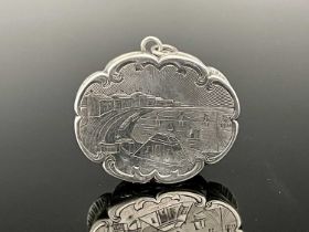 A Victorian silver castle top vinaigrette, of lobed oval form, the cover with engraved scene of