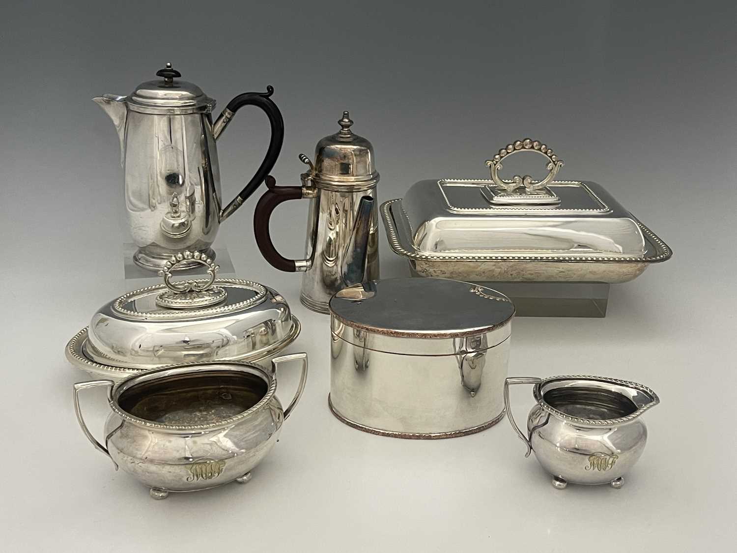 A group of plated wares to include, two entree dishes, coffee/chocolate pot, three-piece tea set,