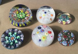 A collection of glass paperweights including Strathearn, millefiori type etc (6)