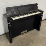 An Eavestaff art deco "Minipiano", with ivorine keys W: 130 cm D: 41 cm H: 86 cm Supplied by Crane &