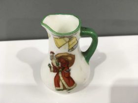 A Royal Doulton miniature Father Christmas ale jug, with painted scribed banner, 'A Handsome Hosters