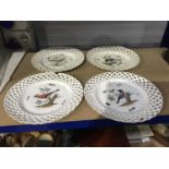 A set of four Meissen reticulated ornithological plates, each painted with a bird study perched on a