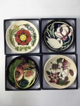 Four Moorcroft Coasters, including Talwin pattern by Nicola Slaney, Bramble Revisited by Alicia