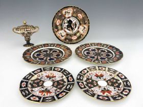 A collection of Royal Crown Derby Imari plates and a pedestal twin handled vase and cover, early